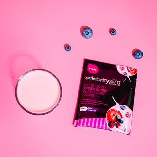 Celebrity Slim Mixed Berry with a glass of Celebrity Slim Mixed Berry and mixed berries