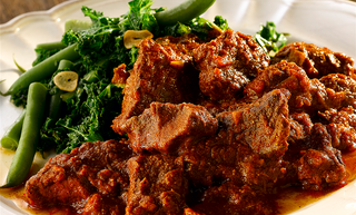 Slow Cooked Beef Curry served with Garlic Kale & Green Beans